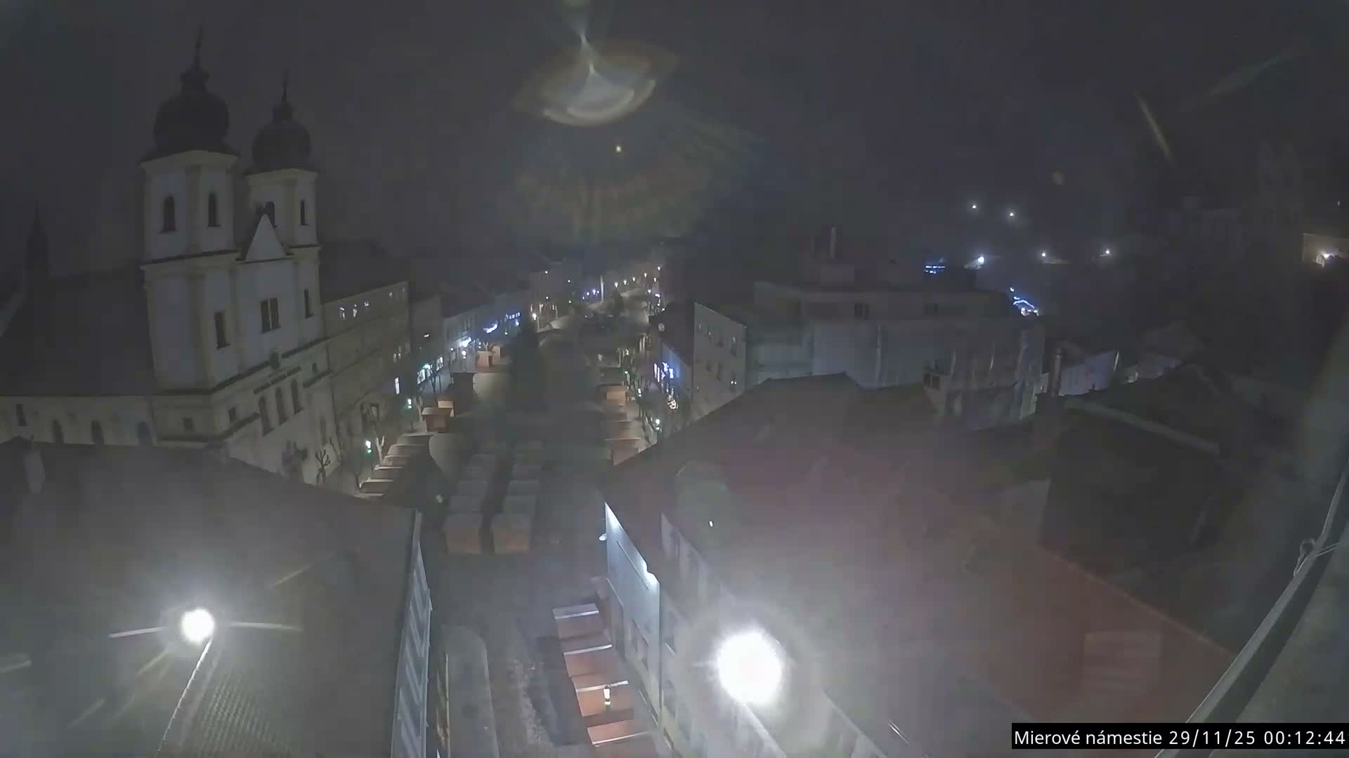 Trenčín, Piaristický kostol sv. Františka Xaverského Church & Trenciansky Hrad (Ttencin Castle) at Mierové námestie Square East View Live Cam - Trencin, Okres Trencin, Slovakia 