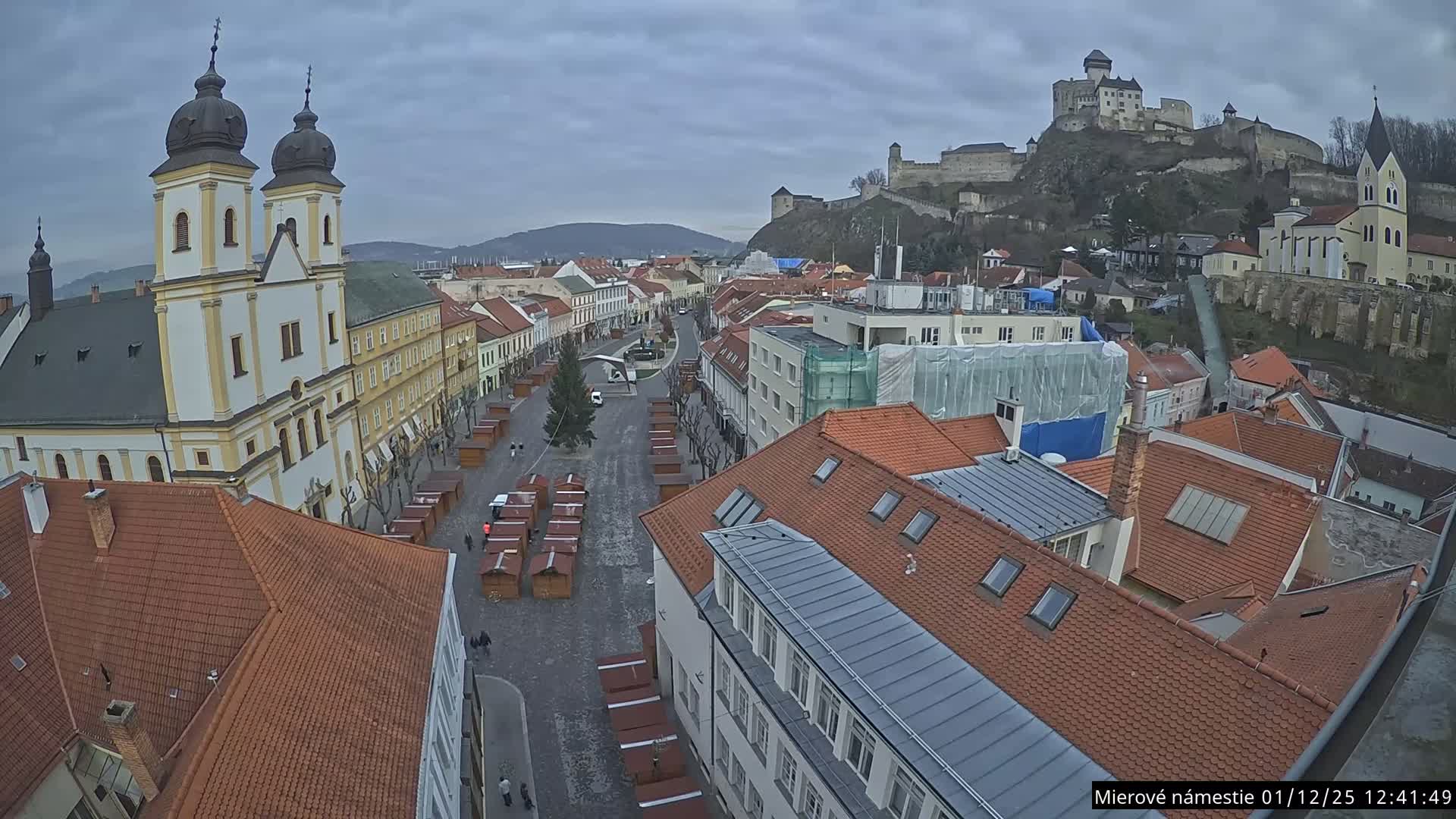 Trenčín, Piaristický kostol sv. Františka Xaverského Church & Trenciansky Hrad (Ttencin Castle) at Mierové námestie Square East View Live Cam - Trencin, Okres Trencin, Slovakia 