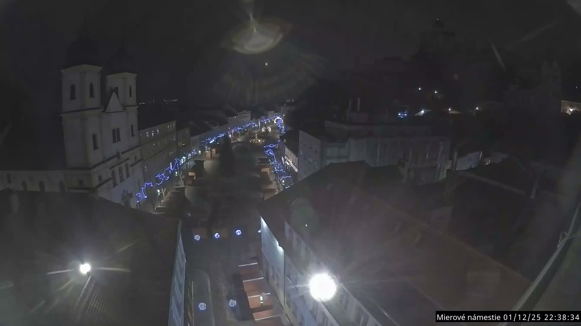 Trenčín, Piaristický kostol sv. Františka Xaverského Church & Trenciansky Hrad (Ttencin Castle) at Mierové námestie Square East View Live Cam - Trencin, Okres Trencin, Slovakia 