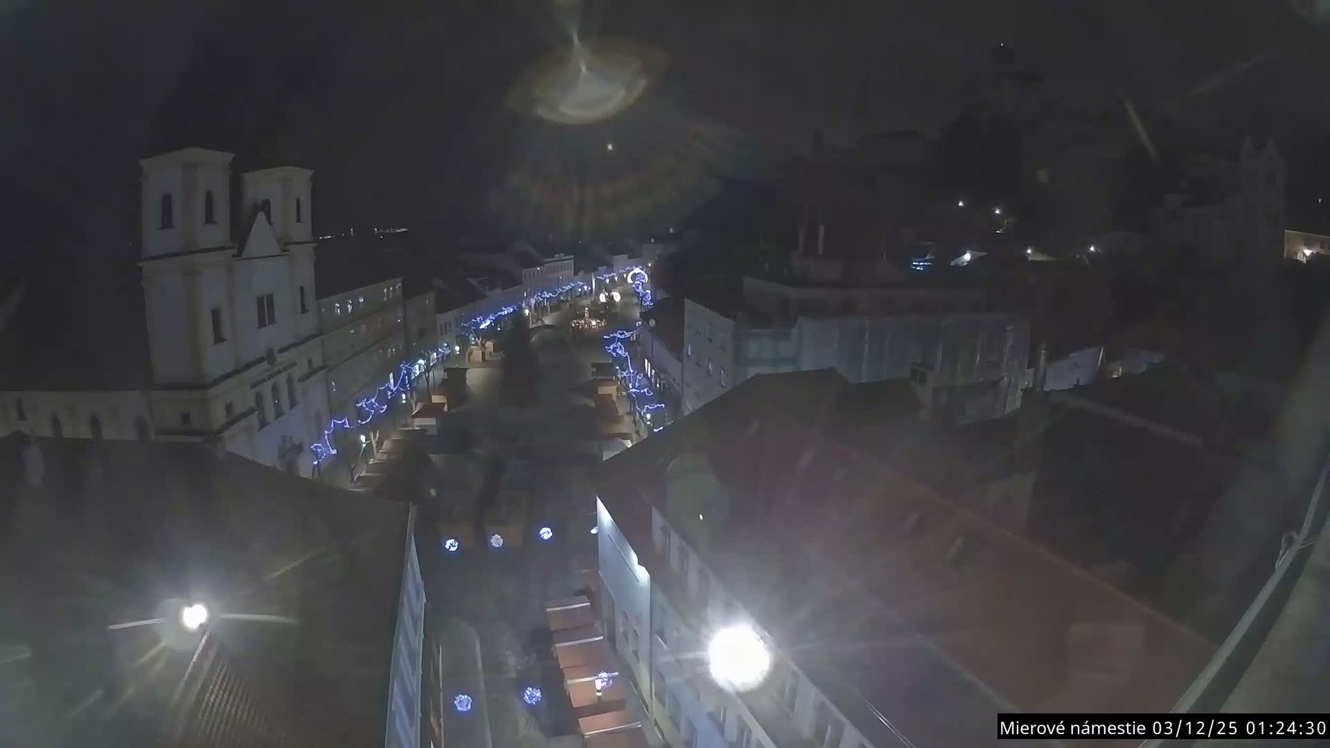 Trenčín, Piaristický kostol sv. Františka Xaverského Church & Trenciansky Hrad (Ttencin Castle) at Mierové námestie Square East View Live Cam - Trencin, Okres Trencin, Slovakia 