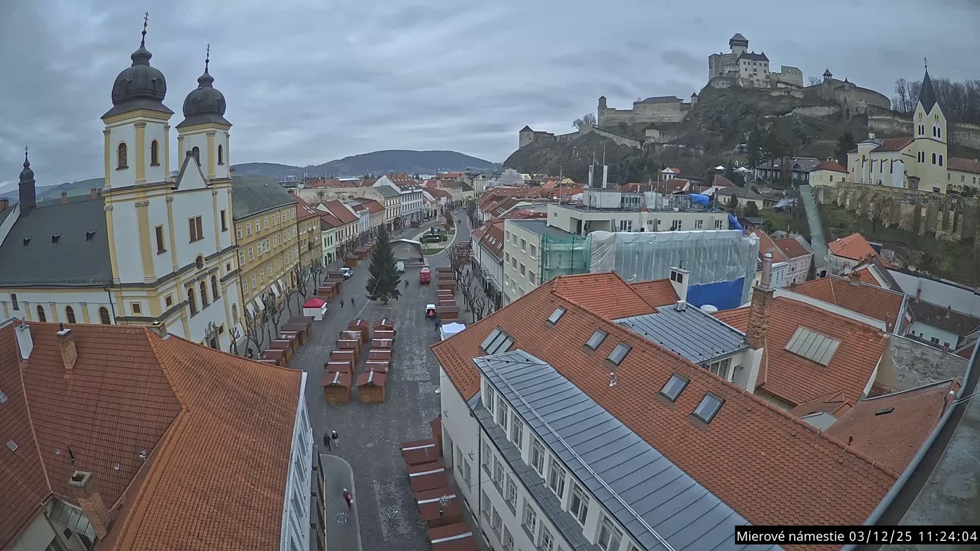 Trenčín, Piaristický kostol sv. Františka Xaverského Church & Trenciansky Hrad (Ttencin Castle) at Mierové námestie Square East View Live Cam - Trencin, Okres Trencin, Slovakia 