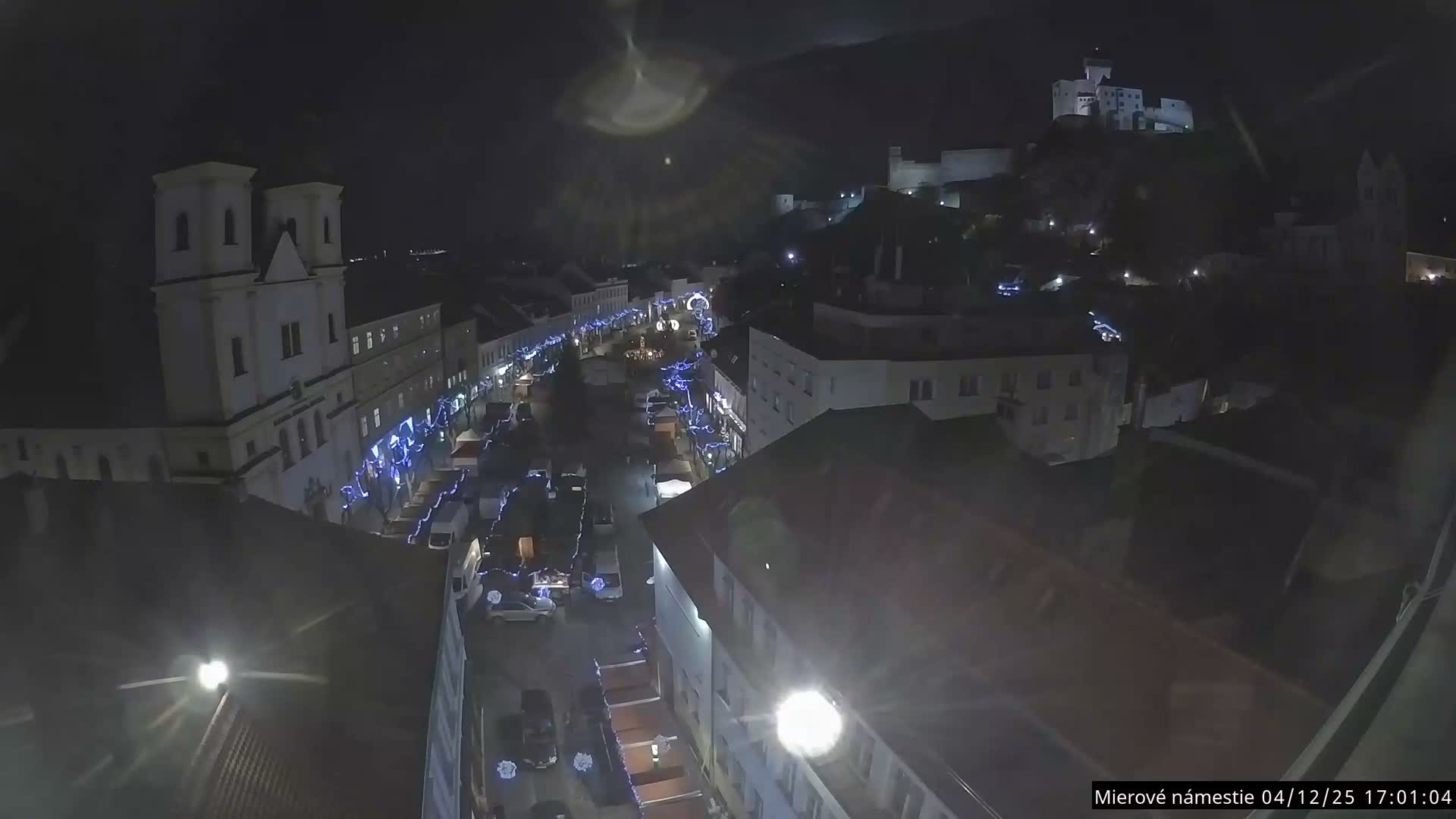 Trenčín, Piaristický kostol sv. Františka Xaverského Church & Trenciansky Hrad (Ttencin Castle) at Mierové námestie Square East View Live Cam - Trencin, Okres Trencin, Slovakia 