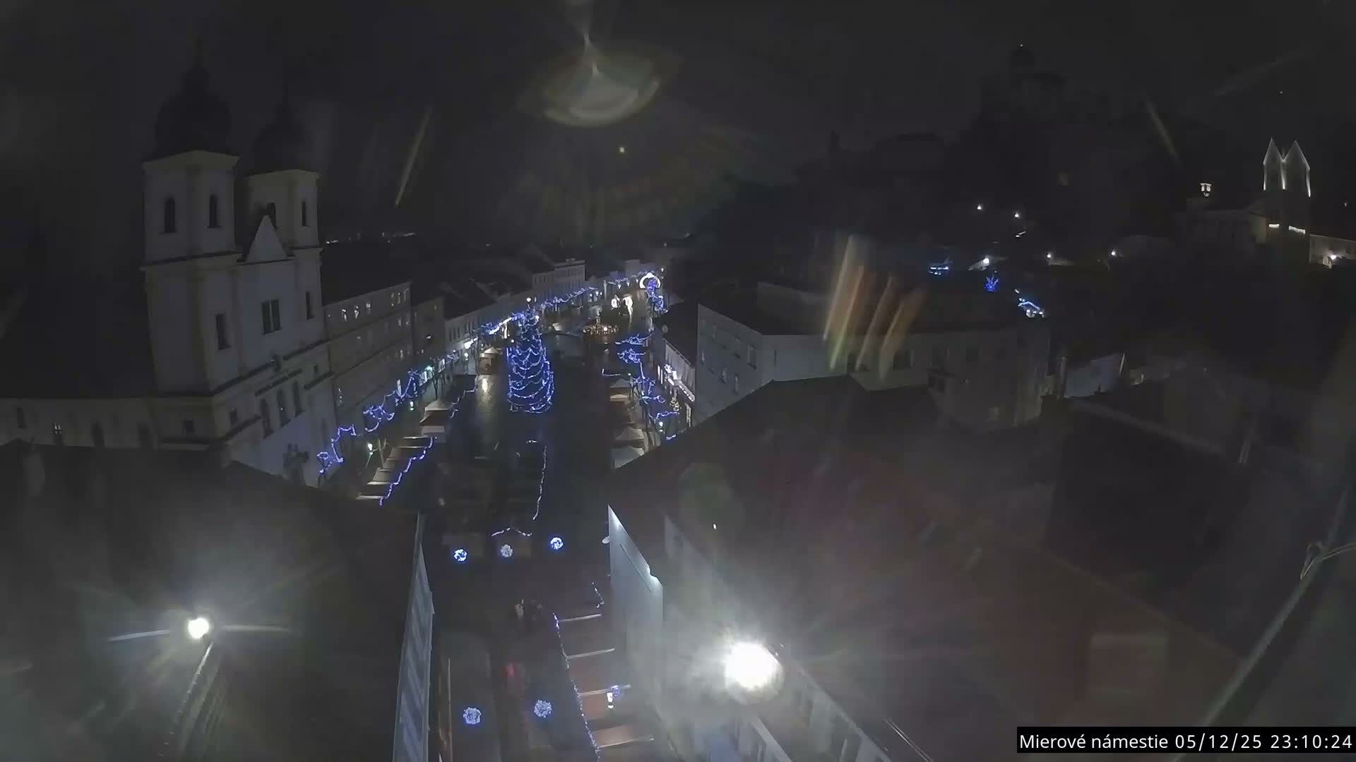 Trenčín, Piaristický kostol sv. Františka Xaverského Church & Trenciansky Hrad (Ttencin Castle) at Mierové námestie Square East View Live Cam - Trencin, Okres Trencin, Slovakia 