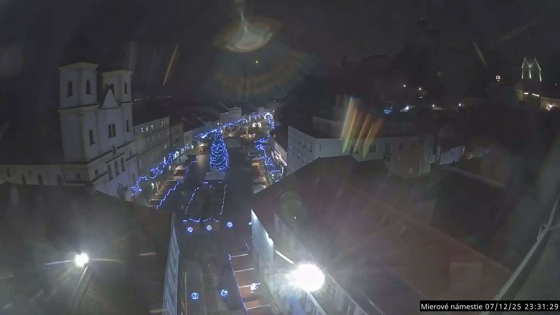 Trenčín, Piaristický kostol sv. Františka Xaverského Church & Trenciansky Hrad (Ttencin Castle) at Mierové námestie Square East View Live Cam - Trencin, Okres Trencin, Slovakia 