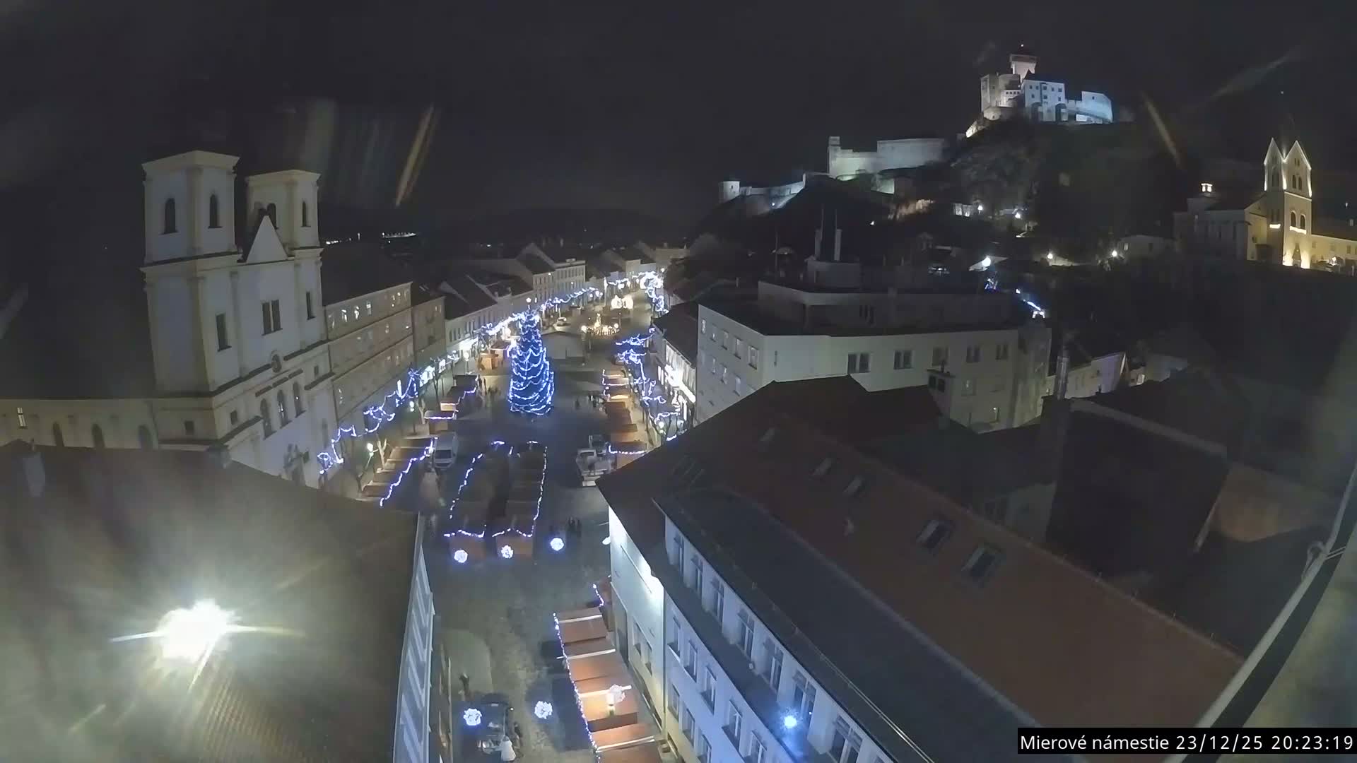 Trenčín, Piaristický kostol sv. Františka Xaverského Church & Trenciansky Hrad (Ttencin Castle) at Mierové námestie Square East View Live Cam - Trencin, Okres Trencin, Slovakia 