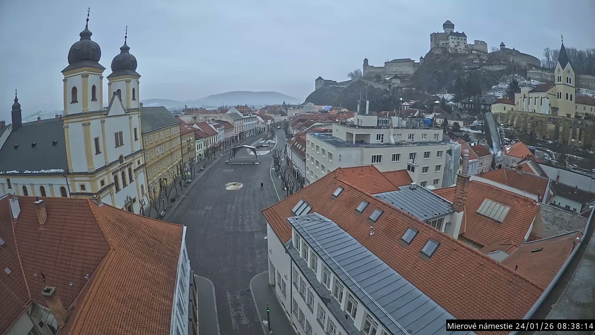Trenčín, Piaristický kostol sv. Františka Xaverského Church & Trenciansky Hrad (Ttencin Castle) at Mierové námestie Square East View Live Cam - Trencin, Okres Trencin, Slovakia 