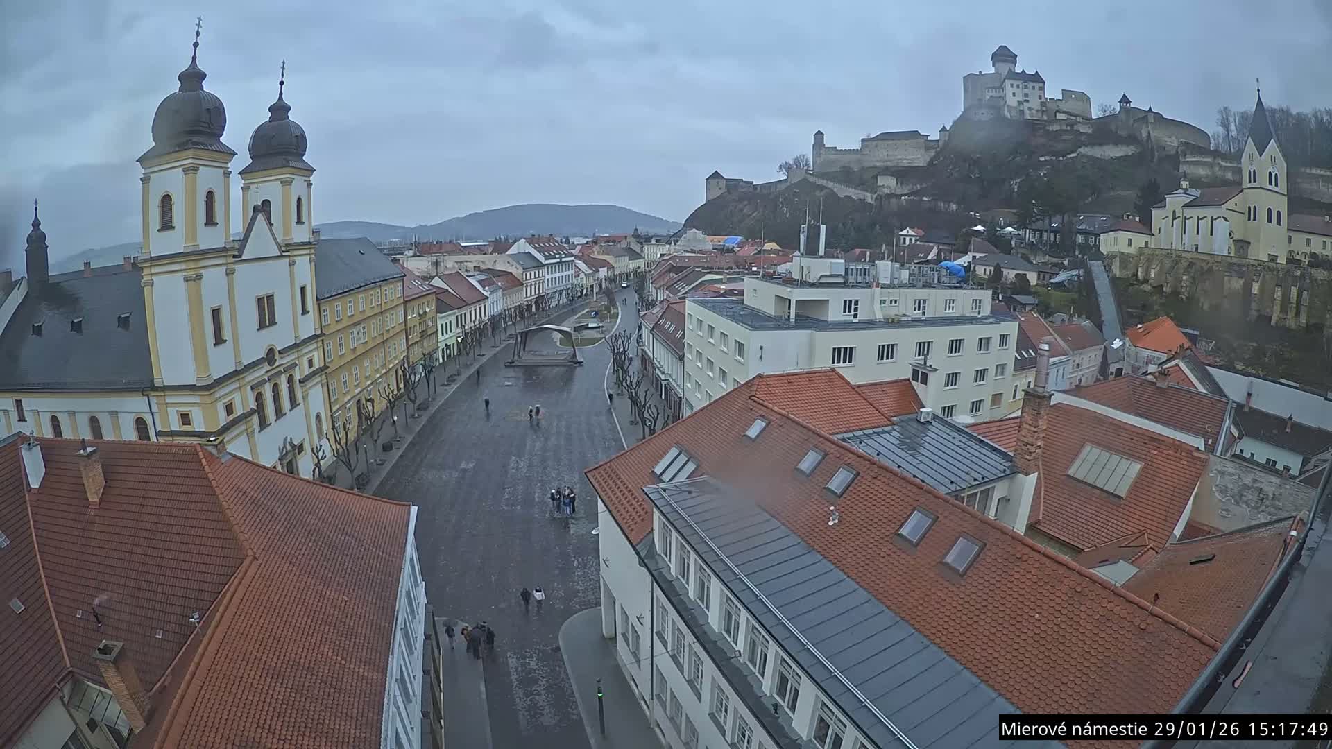 Trenčín, Piaristický kostol sv. Františka Xaverského Church & Trenciansky Hrad (Ttencin Castle) at Mierové námestie Square East View Live Cam - Trencin, Okres Trencin, Slovakia 