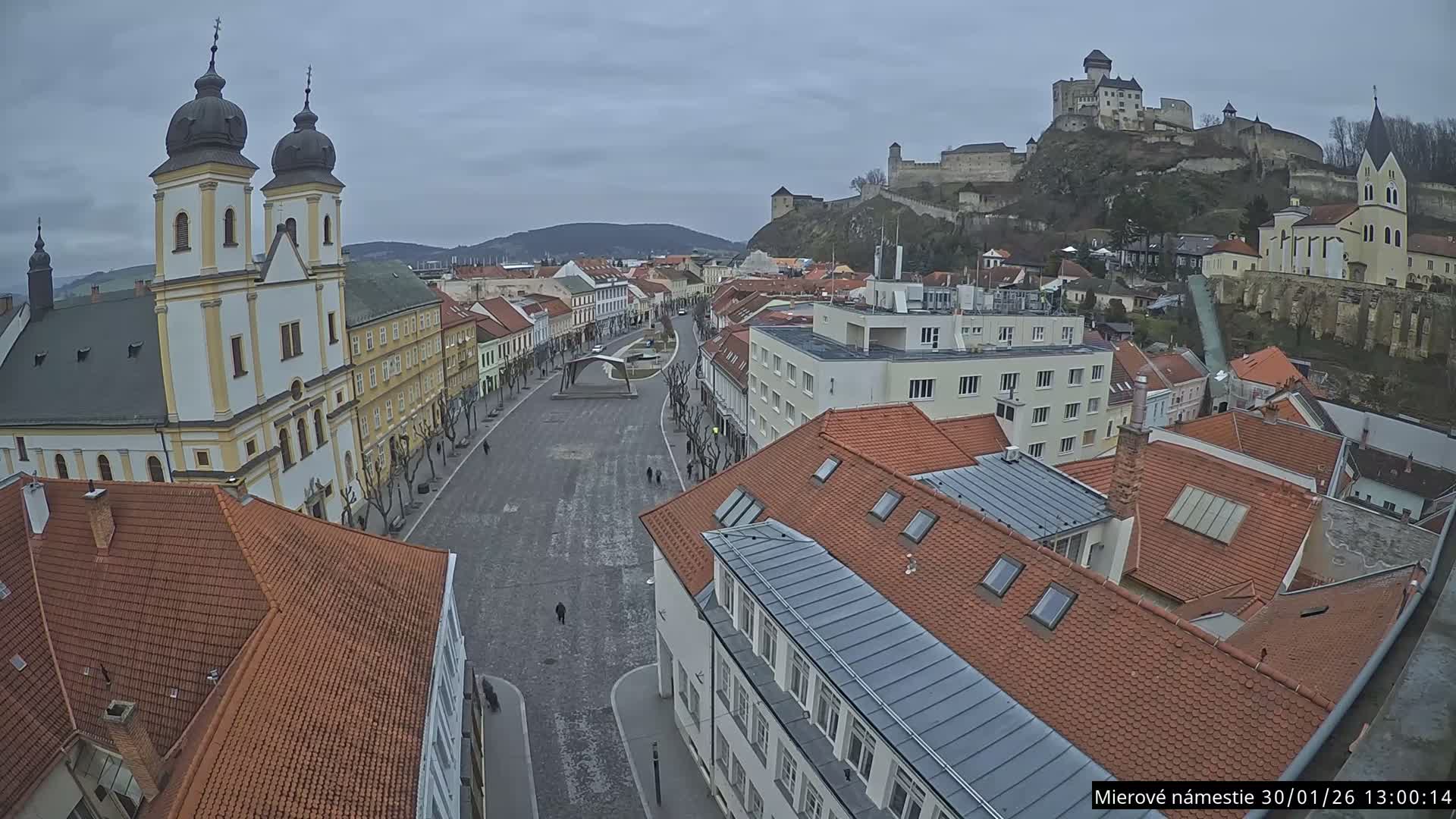 Trenčín, Piaristický kostol sv. Františka Xaverského Church & Trenciansky Hrad (Ttencin Castle) at Mierové námestie Square East View Live Cam - Trencin, Okres Trencin, Slovakia 