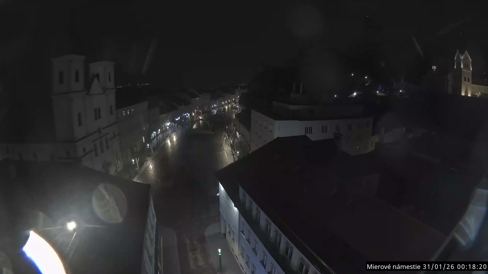 Trenčín, Piaristický kostol sv. Františka Xaverského Church & Trenciansky Hrad (Ttencin Castle) at Mierové námestie Square East View Live Cam - Trencin, Okres Trencin, Slovakia 