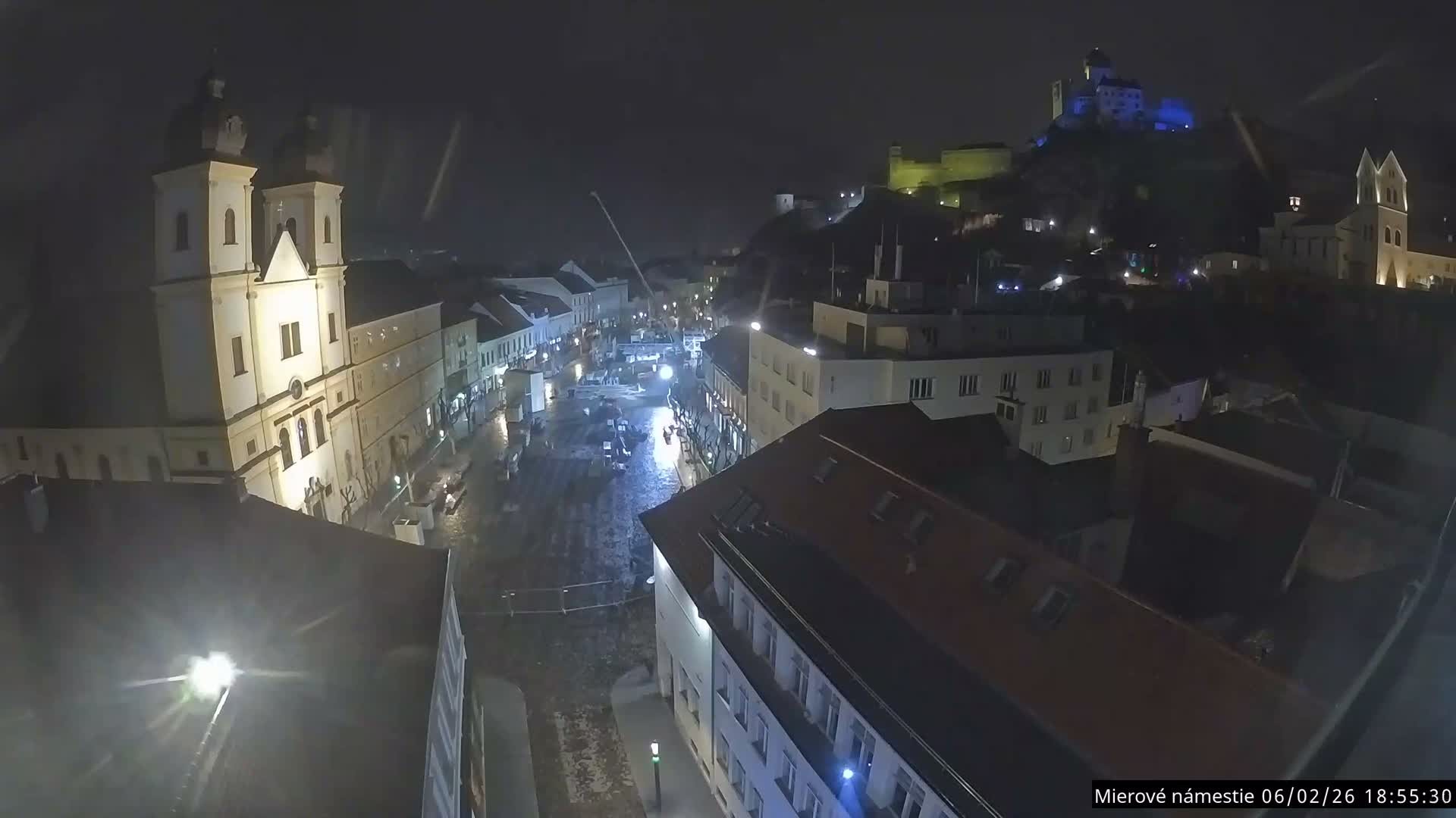 Trenčín, Piaristický kostol sv. Františka Xaverského Church & Trenciansky Hrad (Ttencin Castle) at Mierové námestie Square East View Live Cam - Trencin, Okres Trencin, Slovakia 