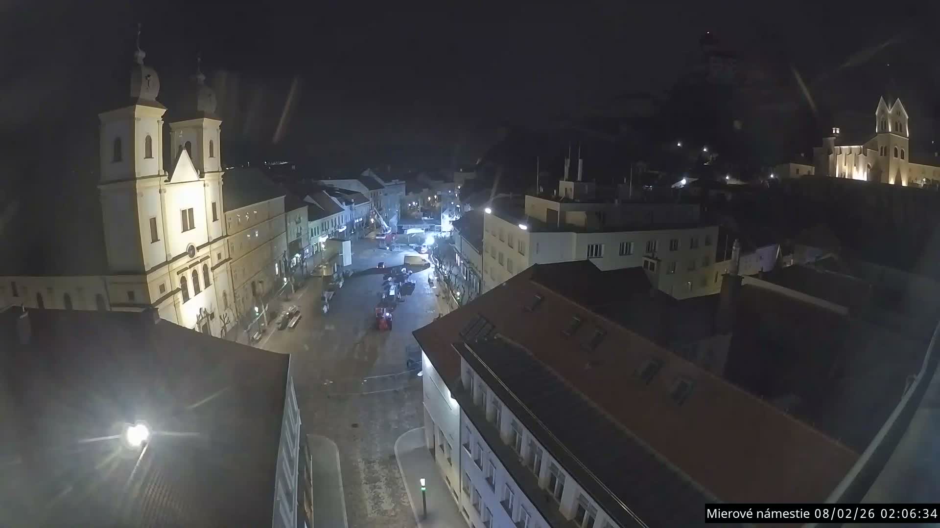Trenčín, Piaristický kostol sv. Františka Xaverského Church & Trenciansky Hrad (Ttencin Castle) at Mierové námestie Square East View Live Cam - Trencin, Okres Trencin, Slovakia 