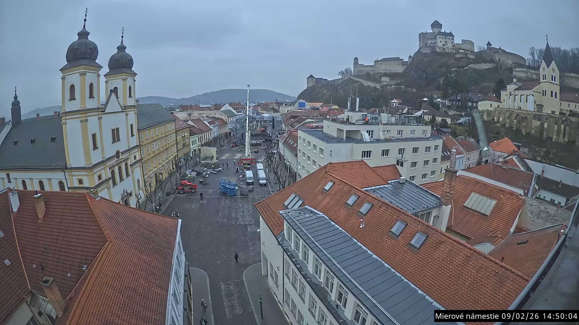 Trenčín, Piaristický kostol sv. Františka Xaverského Church & Trenciansky Hrad (Ttencin Castle) at Mierové námestie Square East View Live Cam - Trencin, Okres Trencin, Slovakia 