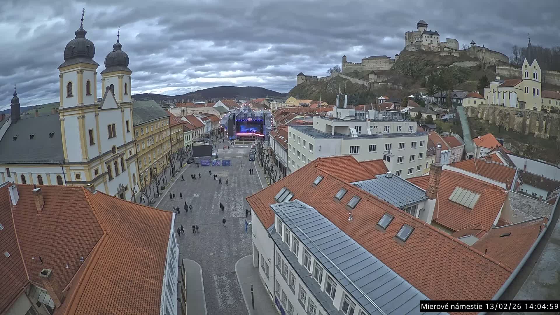 Trenčín, Piaristický kostol sv. Františka Xaverského Church & Trenciansky Hrad (Ttencin Castle) at Mierové námestie Square East View Live Cam - Trencin, Okres Trencin, Slovakia 