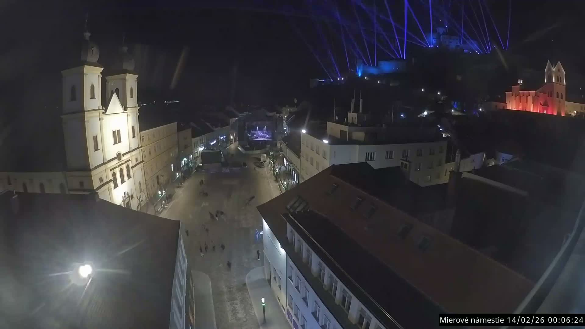 Trenčín, Piaristický kostol sv. Františka Xaverského Church & Trenciansky Hrad (Ttencin Castle) at Mierové námestie Square East View Live Cam - Trencin, Okres Trencin, Slovakia 
