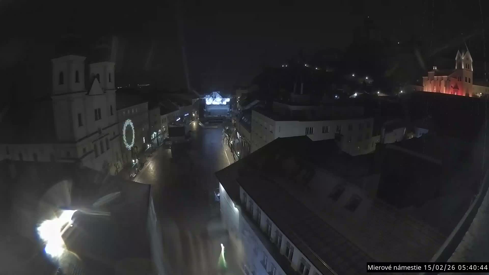 Trenčín, Piaristický kostol sv. Františka Xaverského Church & Trenciansky Hrad (Ttencin Castle) at Mierové námestie Square East View Live Cam - Trencin, Okres Trencin, Slovakia 