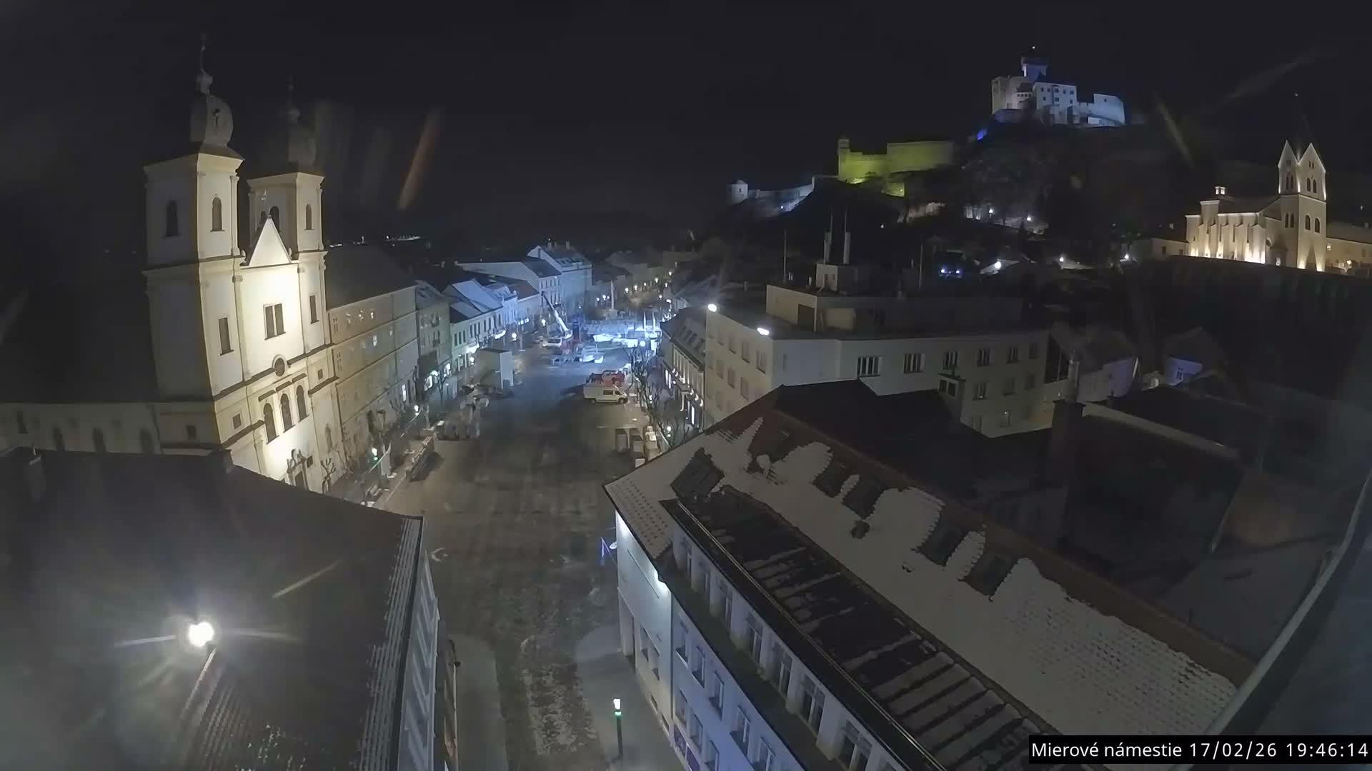 Trenčín, Piaristický kostol sv. Františka Xaverského Church & Trenciansky Hrad (Ttencin Castle) at Mierové námestie Square East View Live Cam - Trencin, Okres Trencin, Slovakia 