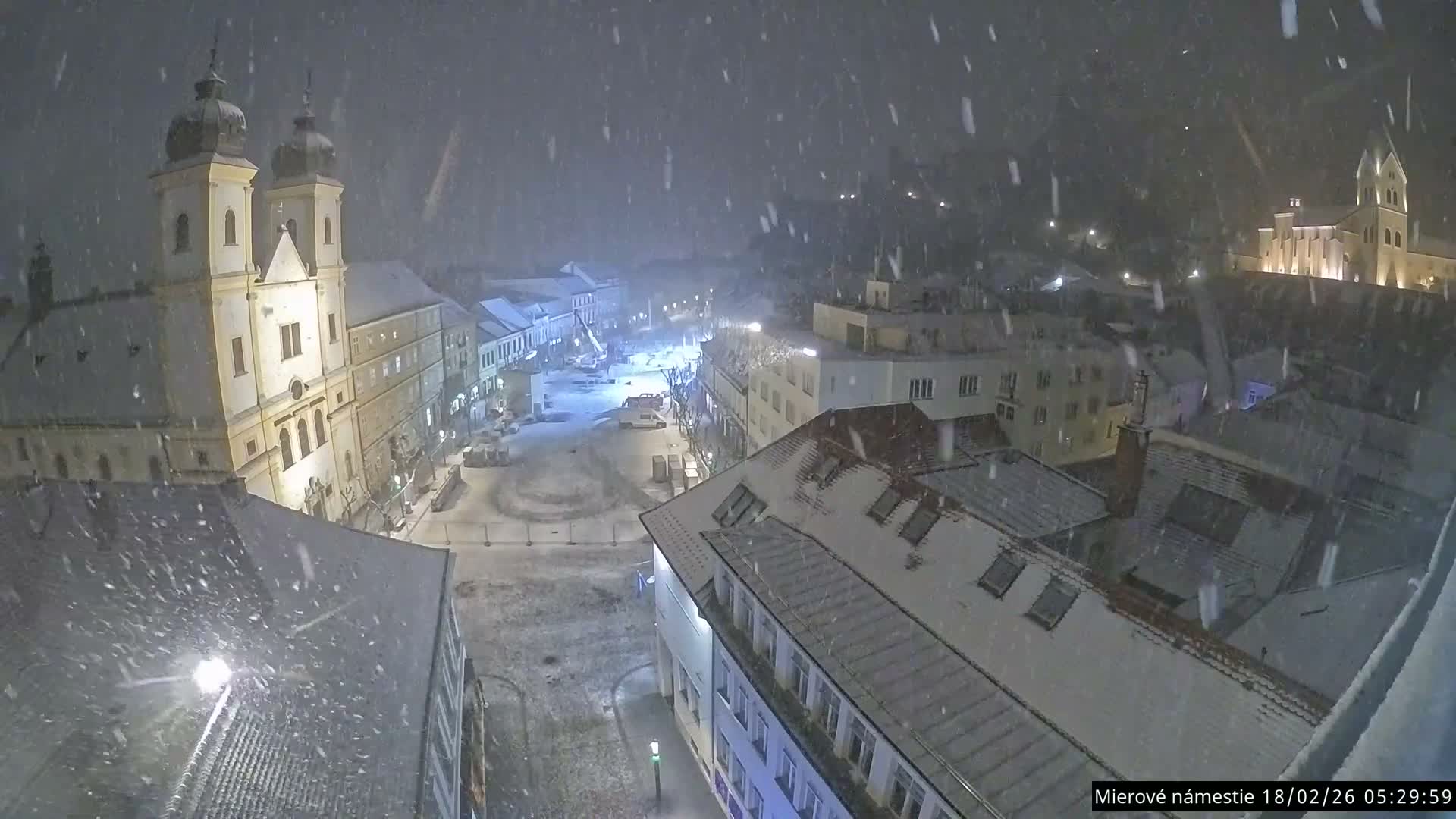 Trenčín, Piaristický kostol sv. Františka Xaverského Church & Trenciansky Hrad (Ttencin Castle) at Mierové námestie Square East View Live Cam - Trencin, Okres Trencin, Slovakia 