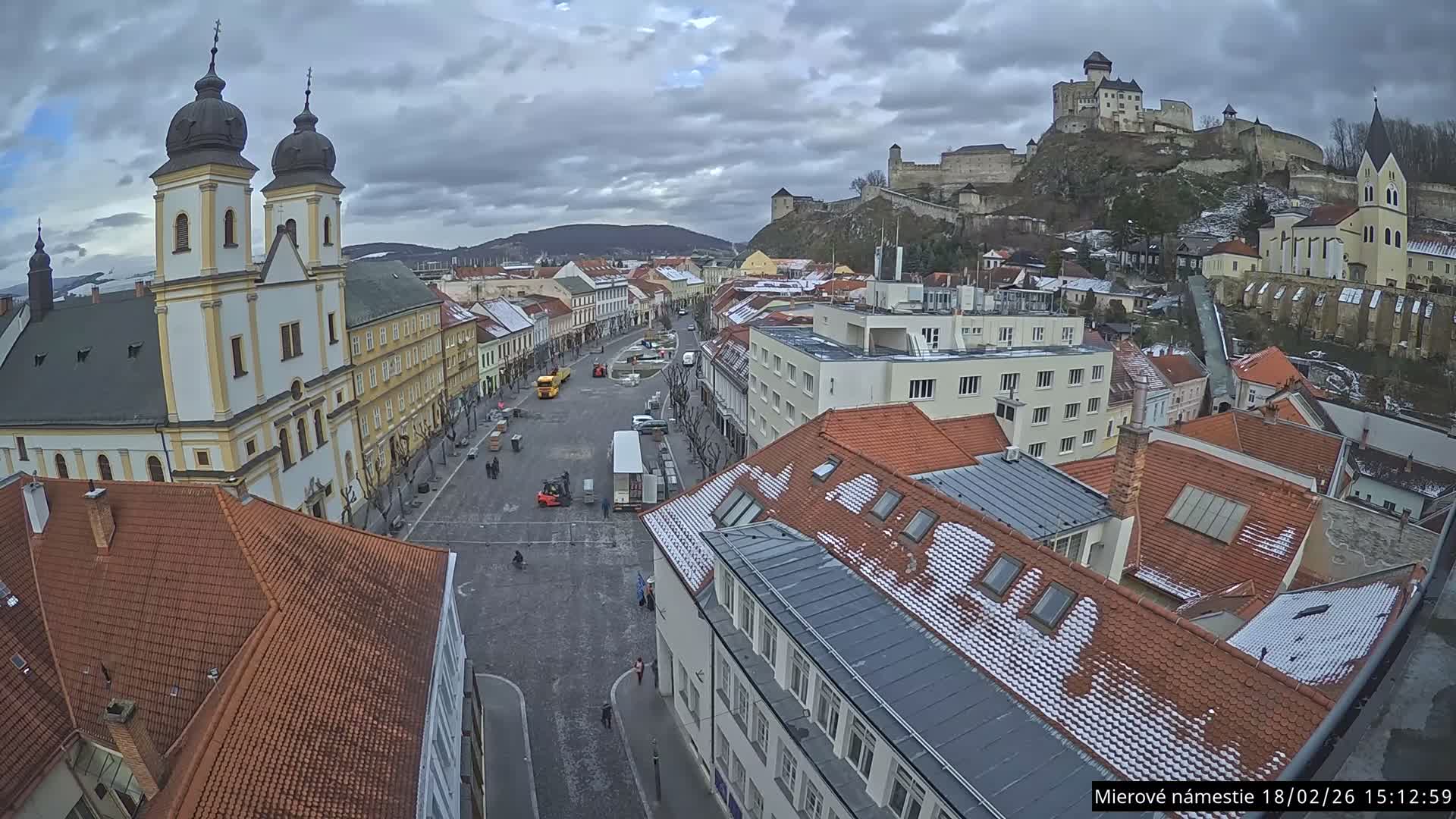 Trenčín, Piaristický kostol sv. Františka Xaverského Church & Trenciansky Hrad (Ttencin Castle) at Mierové námestie Square East View Live Cam - Trencin, Okres Trencin, Slovakia 