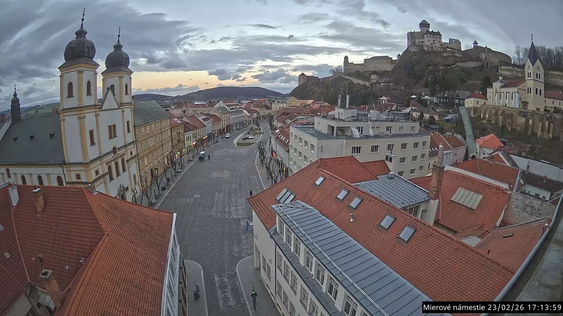 Trenčín, Piaristický kostol sv. Františka Xaverského Church & Trenciansky Hrad (Ttencin Castle) at Mierové námestie Square East View Live Cam - Trencin, Okres Trencin, Slovakia 