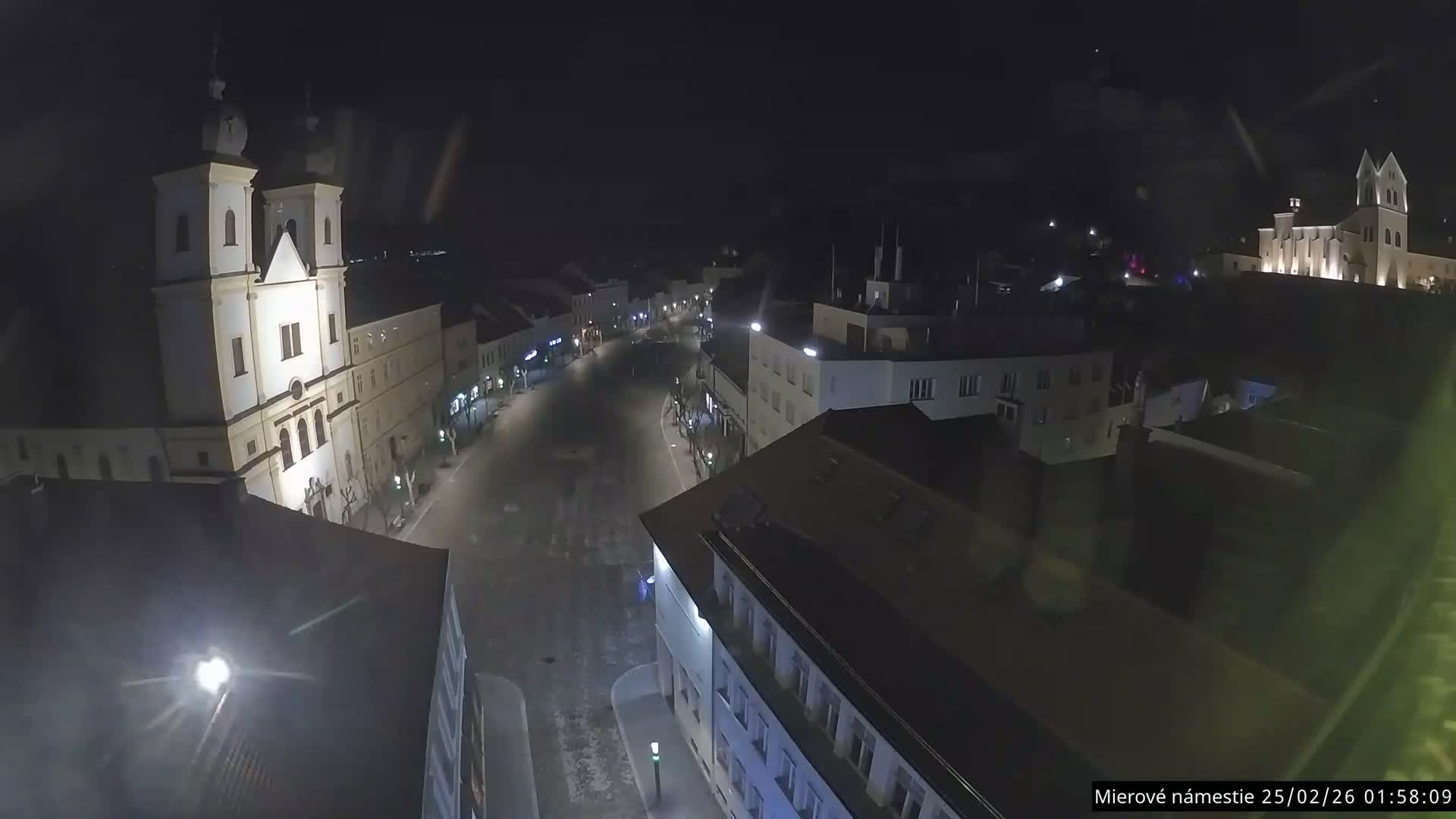 Trenčín, Piaristický kostol sv. Františka Xaverského Church & Trenciansky Hrad (Ttencin Castle) at Mierové námestie Square East View Live Cam - Trencin, Okres Trencin, Slovakia 
