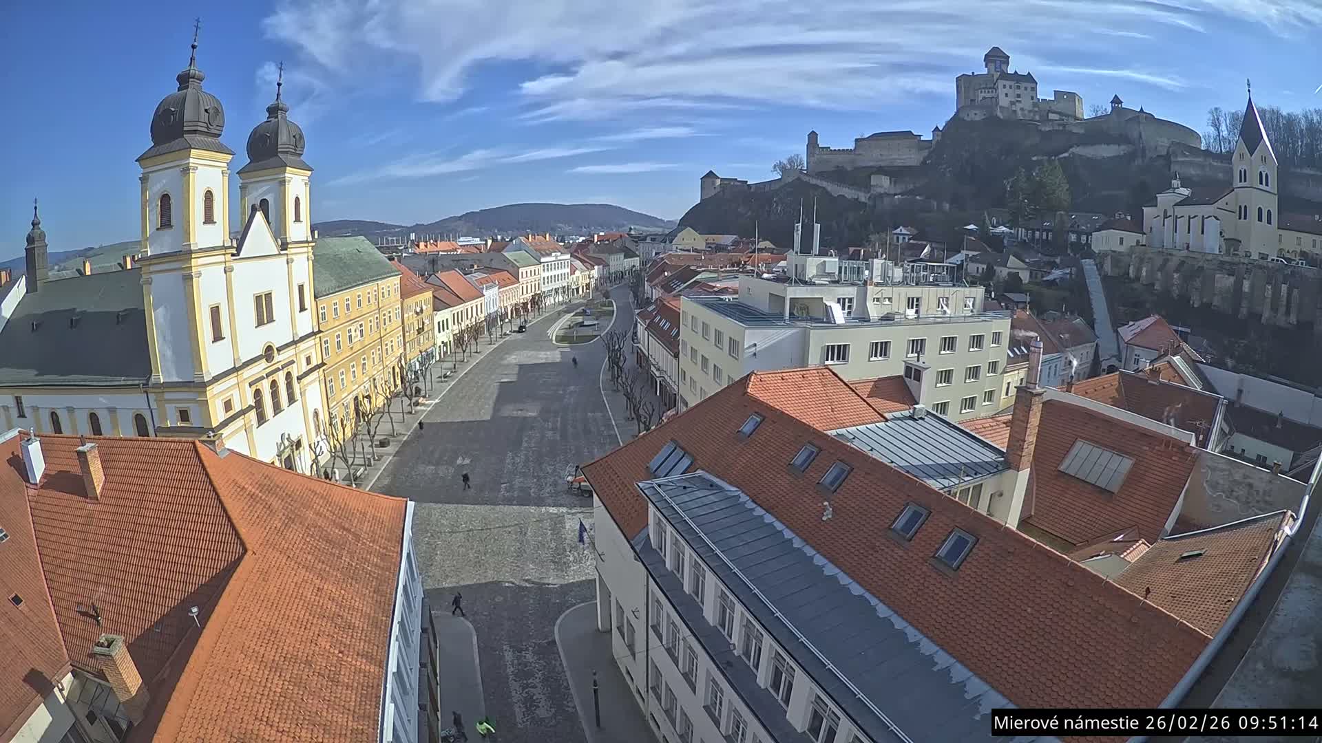 Trenčín, Piaristický kostol sv. Františka Xaverského Church & Trenciansky Hrad (Ttencin Castle) at Mierové námestie Square East View Live Cam - Trencin, Okres Trencin, Slovakia 