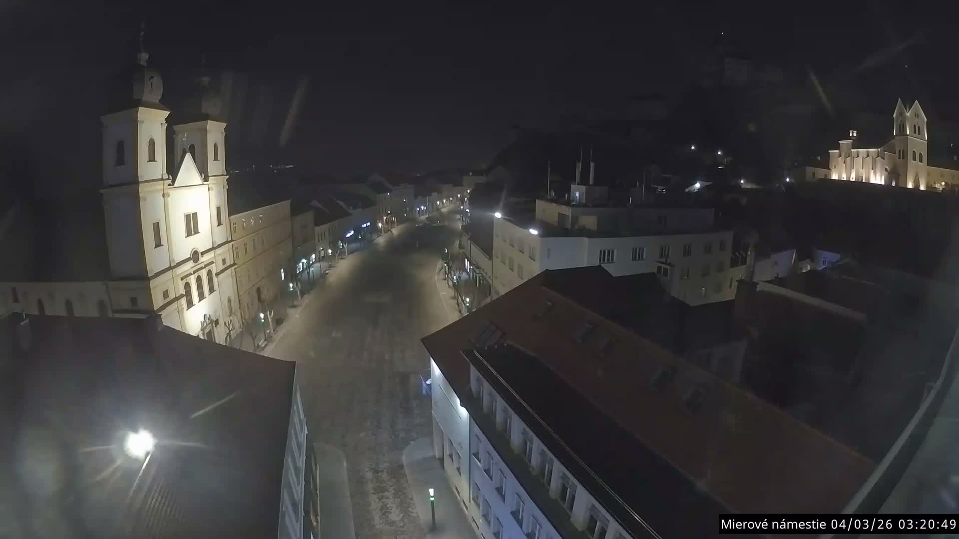 Trenčín, Piaristický kostol sv. Františka Xaverského Church & Trenciansky Hrad (Ttencin Castle) at Mierové námestie Square East View Live Cam - Trencin, Okres Trencin, Slovakia 