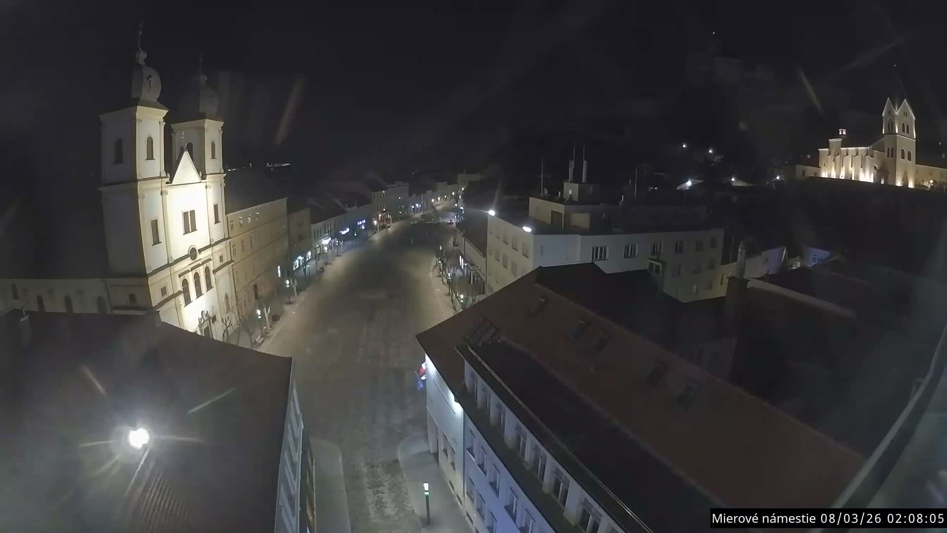 Trenčín, Piaristický kostol sv. Františka Xaverského Church & Trenciansky Hrad (Ttencin Castle) at Mierové námestie Square East View Live Cam - Trencin, Okres Trencin, Slovakia 