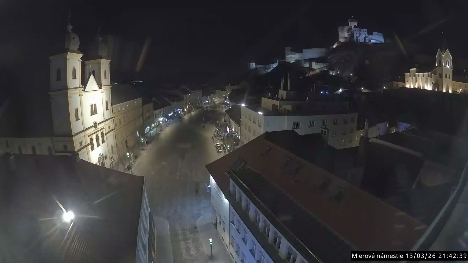 Trenčín, Piaristický kostol sv. Františka Xaverského Church & Trenciansky Hrad (Ttencin Castle) at Mierové námestie Square East View Live Cam - Trencin, Okres Trencin, Slovakia 
