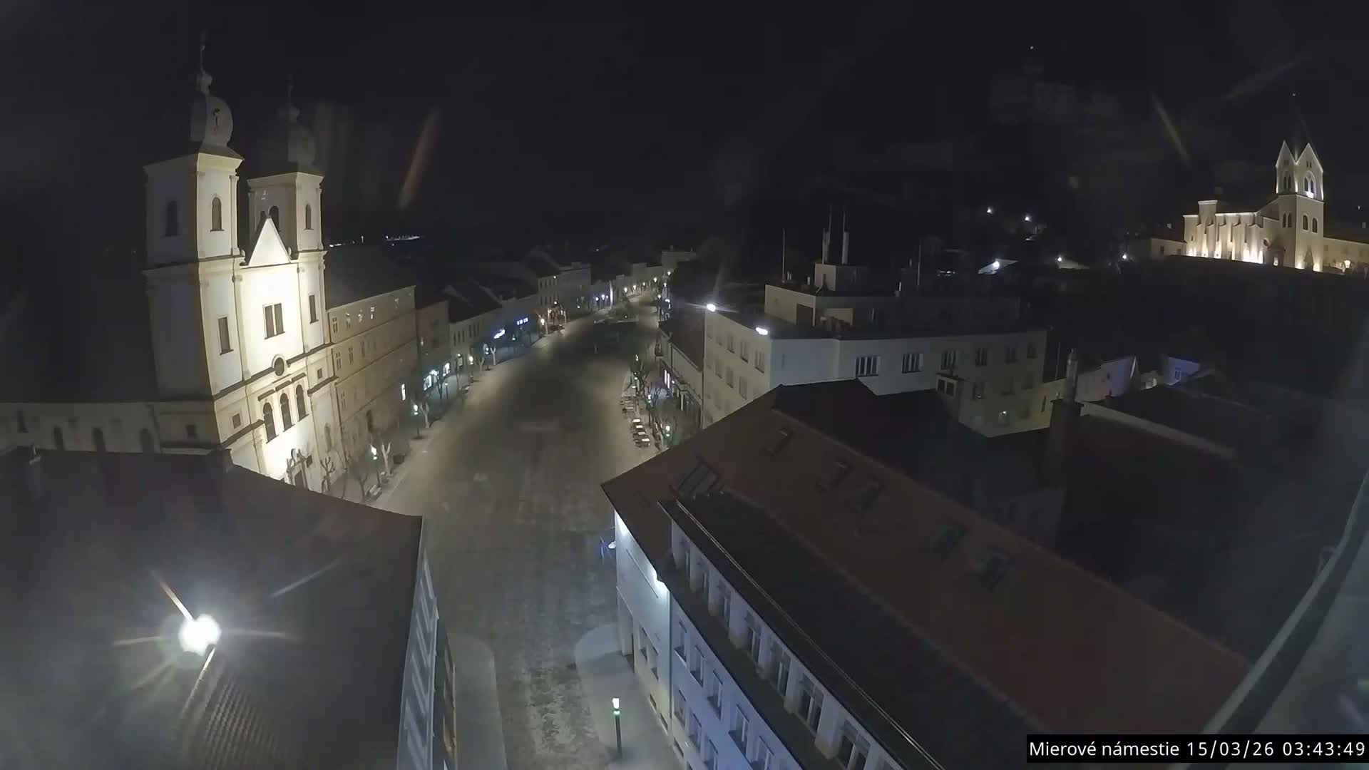 Trenčín, Piaristický kostol sv. Františka Xaverského Church & Trenciansky Hrad (Ttencin Castle) at Mierové námestie Square East View Live Cam - Trencin, Okres Trencin, Slovakia 