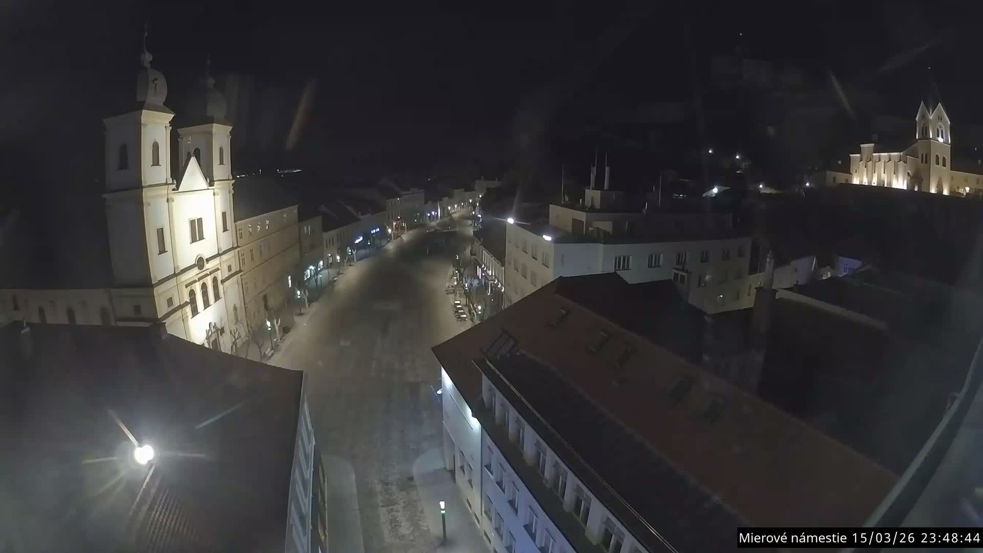 Trenčín, Piaristický kostol sv. Františka Xaverského Church & Trenciansky Hrad (Ttencin Castle) at Mierové námestie Square East View Live Cam - Trencin, Okres Trencin, Slovakia 