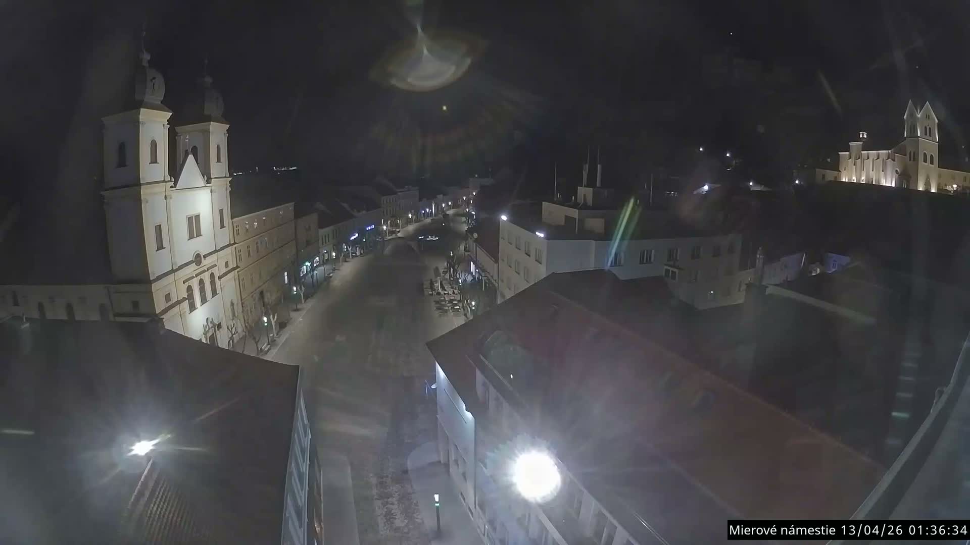 Trenčín, Piaristický kostol sv. Františka Xaverského Church & Trenciansky Hrad (Ttencin Castle) at Mierové námestie Square East View Live Cam - Trencin, Okres Trencin, Slovakia 