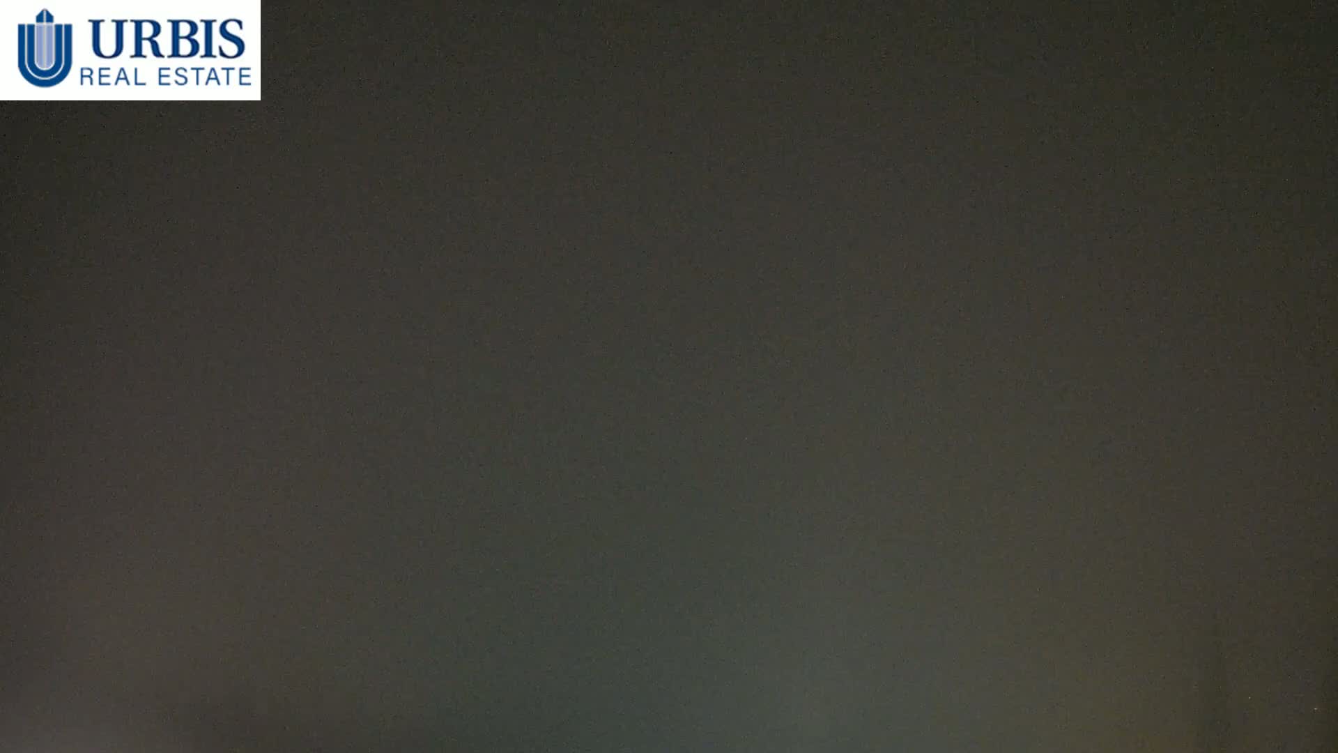 A dark, overcast sky is visible at night.