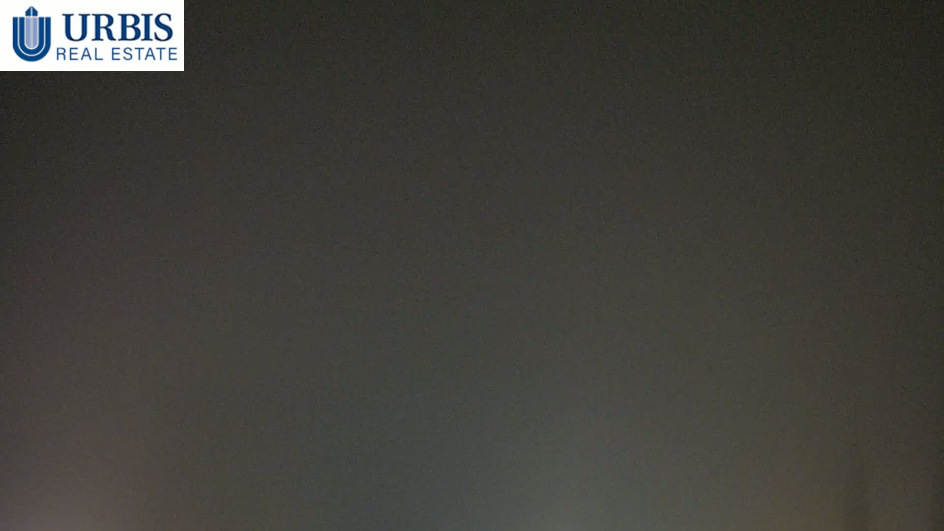 A dark, hazy sky is visible at night.