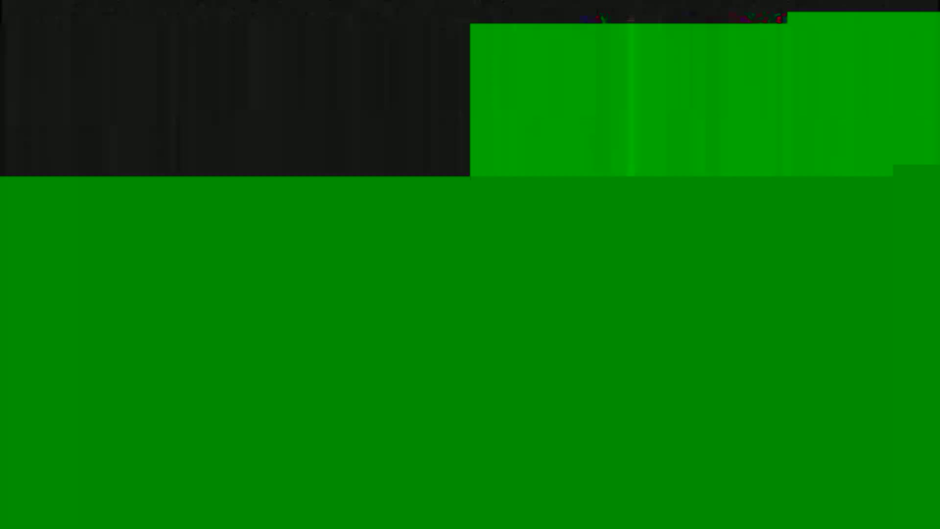 The image shows a mostly green field with a smaller dark gray section at the top.