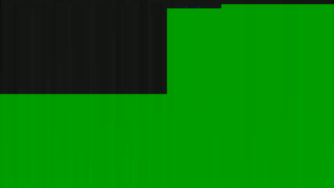 The image shows a mostly green surface with a smaller black area in the upper left corner.