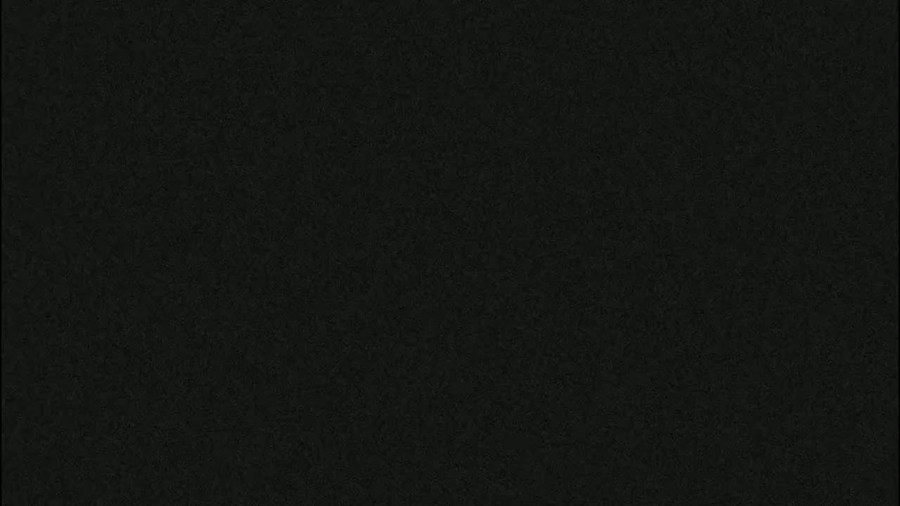 The image is a solid dark-grey field with a slightly textured surface.