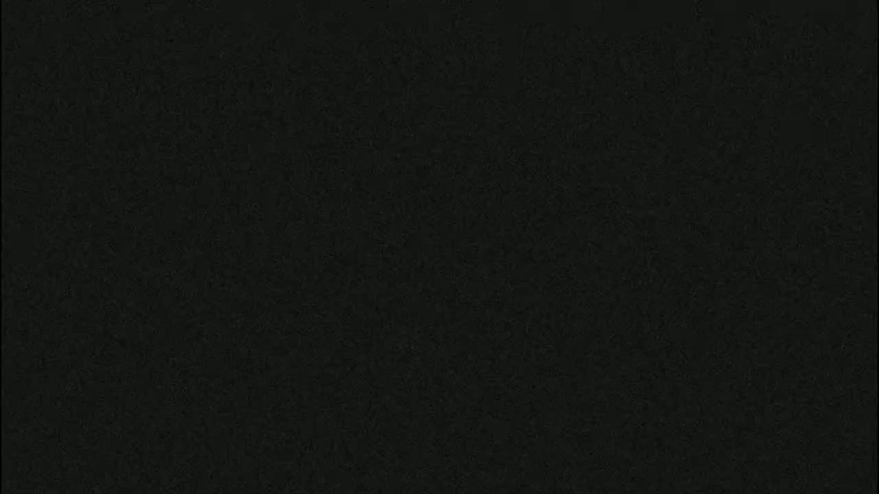 The image shows a dark gray, textured surface.