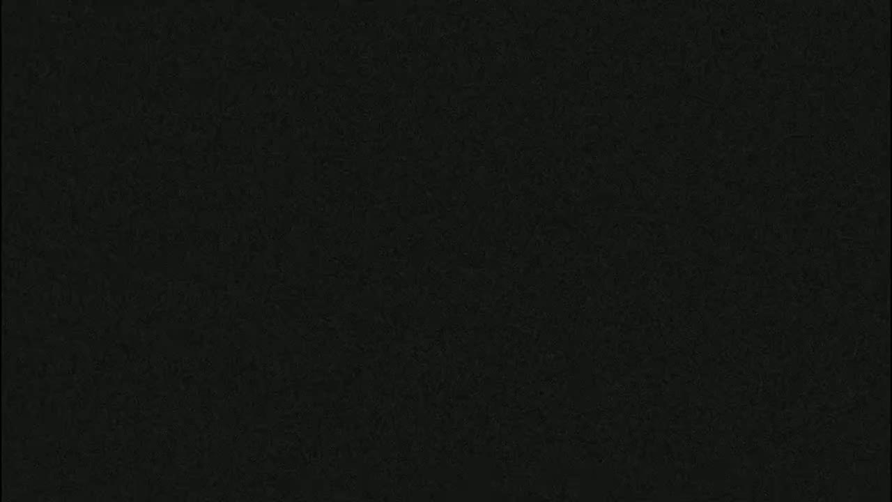 The image is a solid dark gray or black field with a slightly textured appearance.