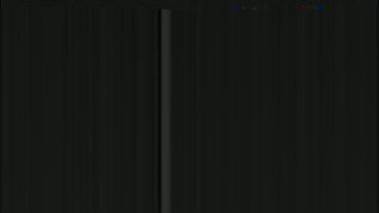 A dark, mostly black image shows a thin, vertical, lighter gray line in the center.