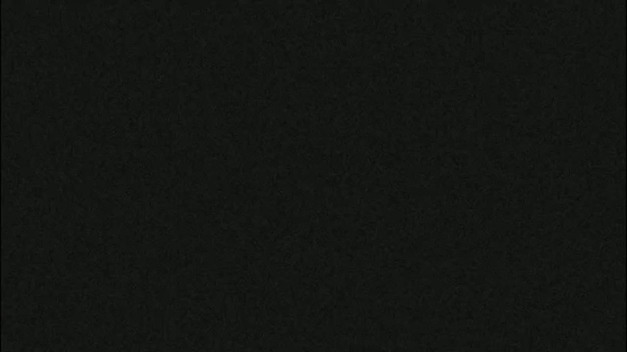 The image shows a uniformly dark gray textured surface.