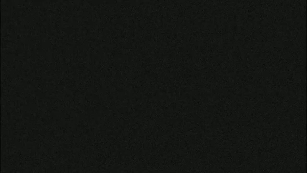 The image shows a dark gray textured surface.