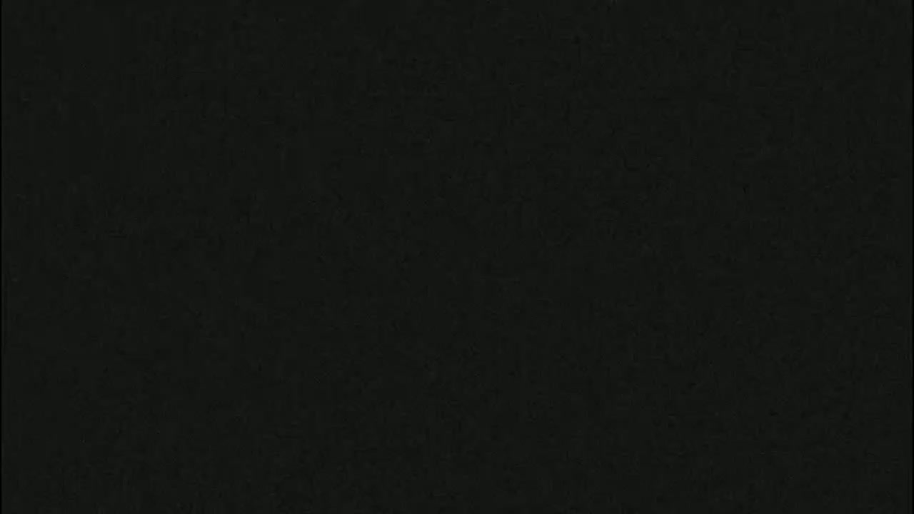 The image is a solid dark-grey or black background with a slightly textured surface.