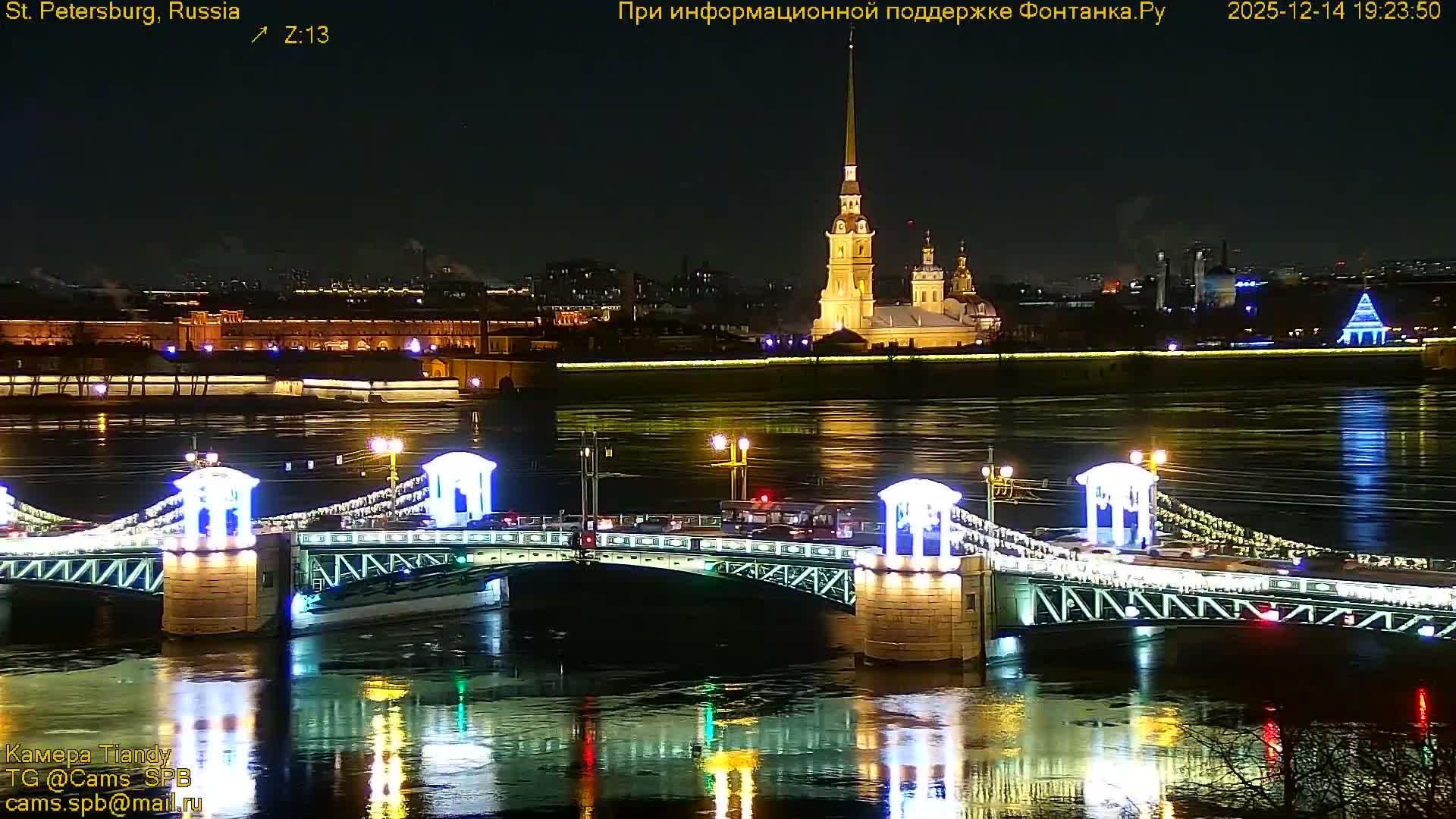 The image captures a wide urban river flanked by a road with sparse traffic and buildings, leading to several distant bridges and a cityscape, all beneath a heavily overcast and gloomy sky.