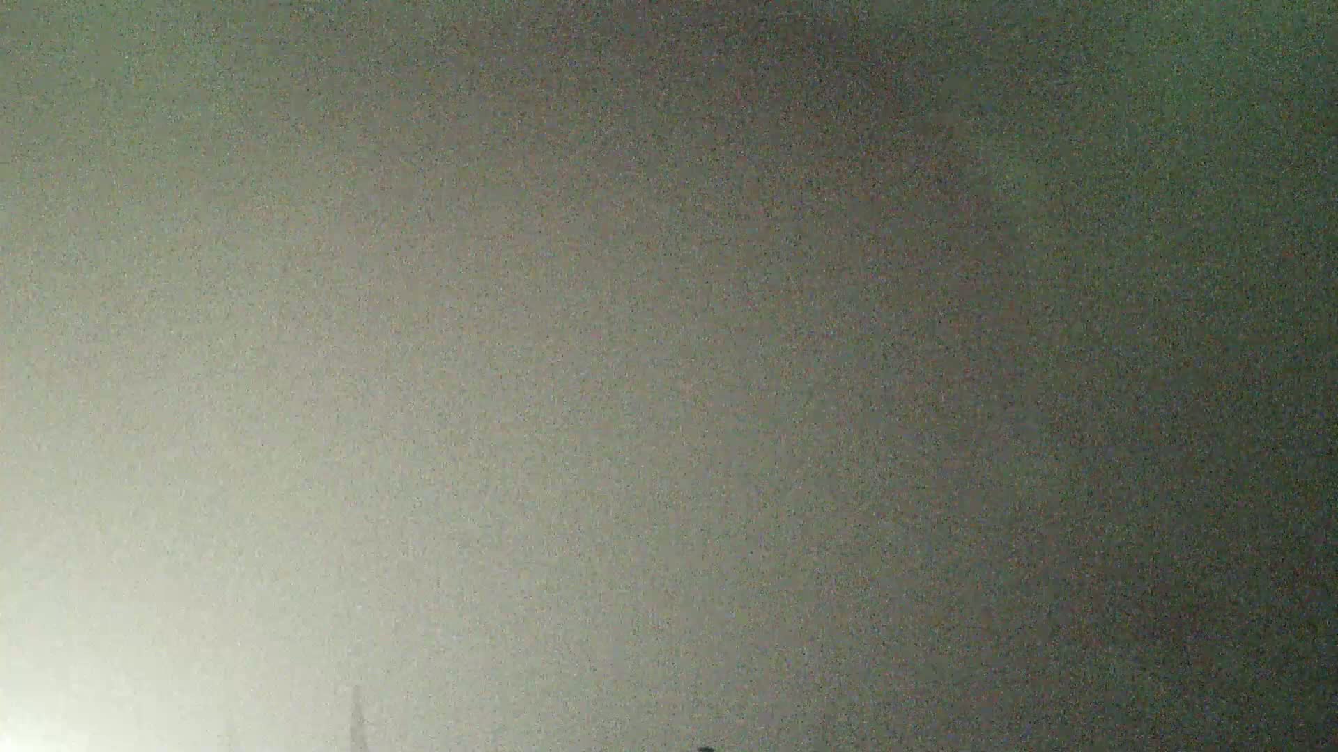 A hazy, light gray sky is visible, possibly indicating foggy or overcast conditions.