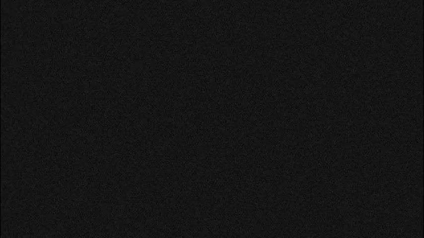 The image is a solid black with a subtle, fine-grained texture across its surface.