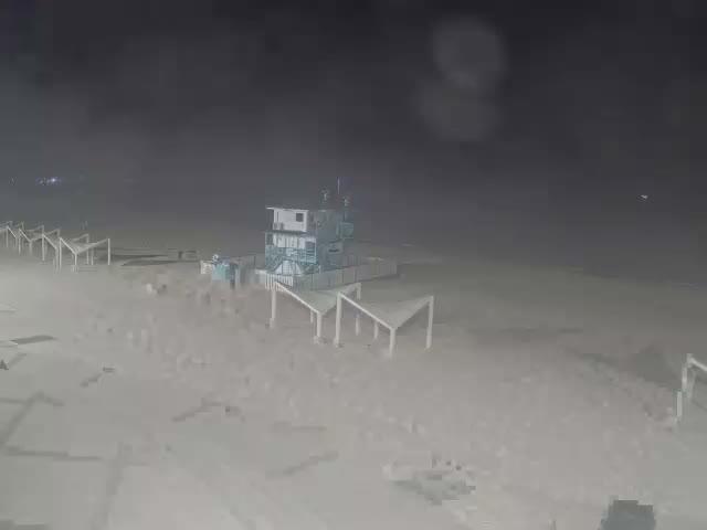 The image is a solid black with a subtle, fine-grained texture across its surface.