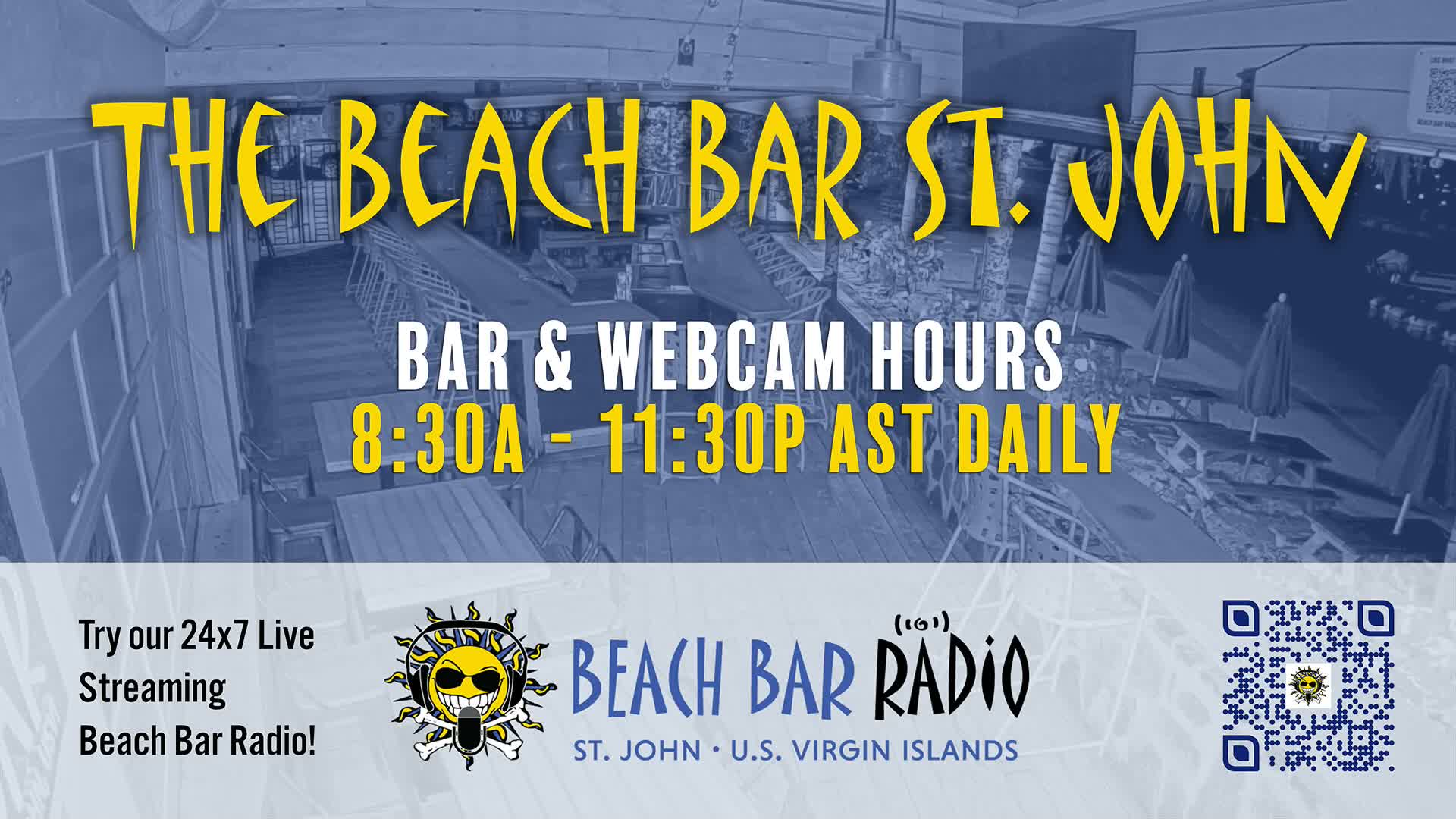 A blue-tinted, elevated view shows an empty outdoor beach bar area with numerous tables and closed umbrellas under daytime conditions.