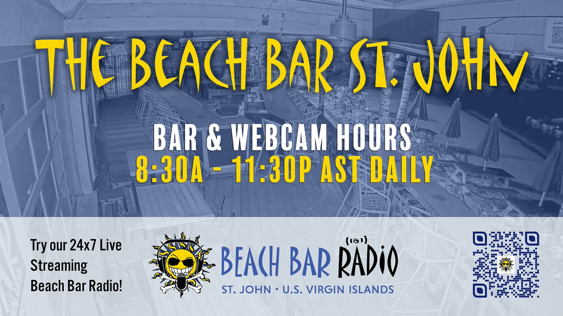 A blue-tinted overhead view shows a calm outdoor patio with numerous tables, chairs, and several closed umbrellas, suggesting nighttime or low-light conditions.