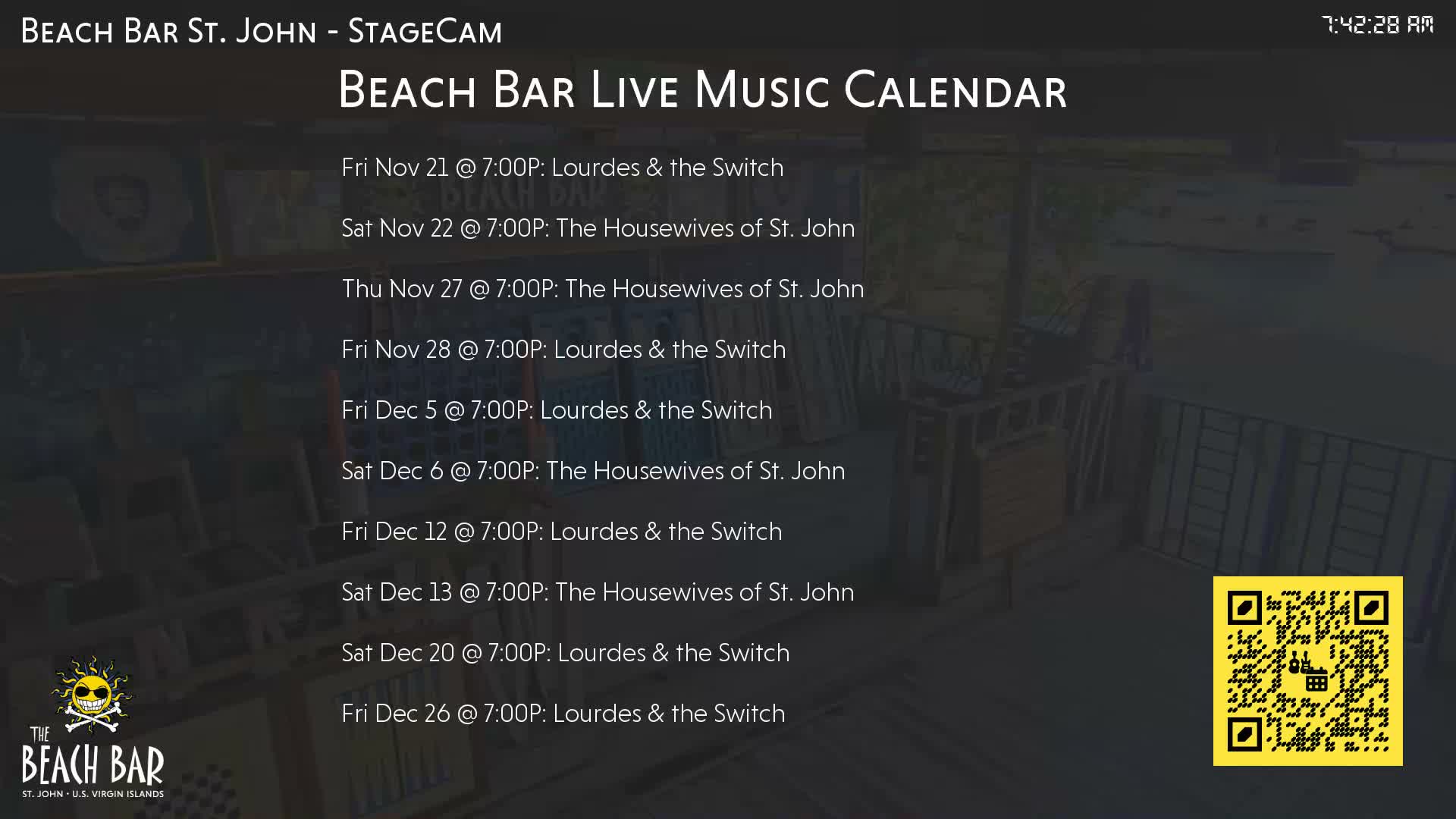 The image displays a blurry, dark outdoor patio or bar area with indistinct furniture, captured in the very early morning.