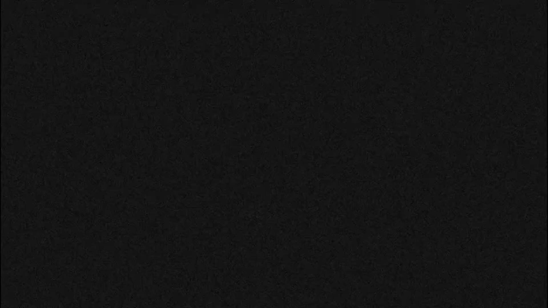 A completely black image with a very subtle, fine-grained texture.